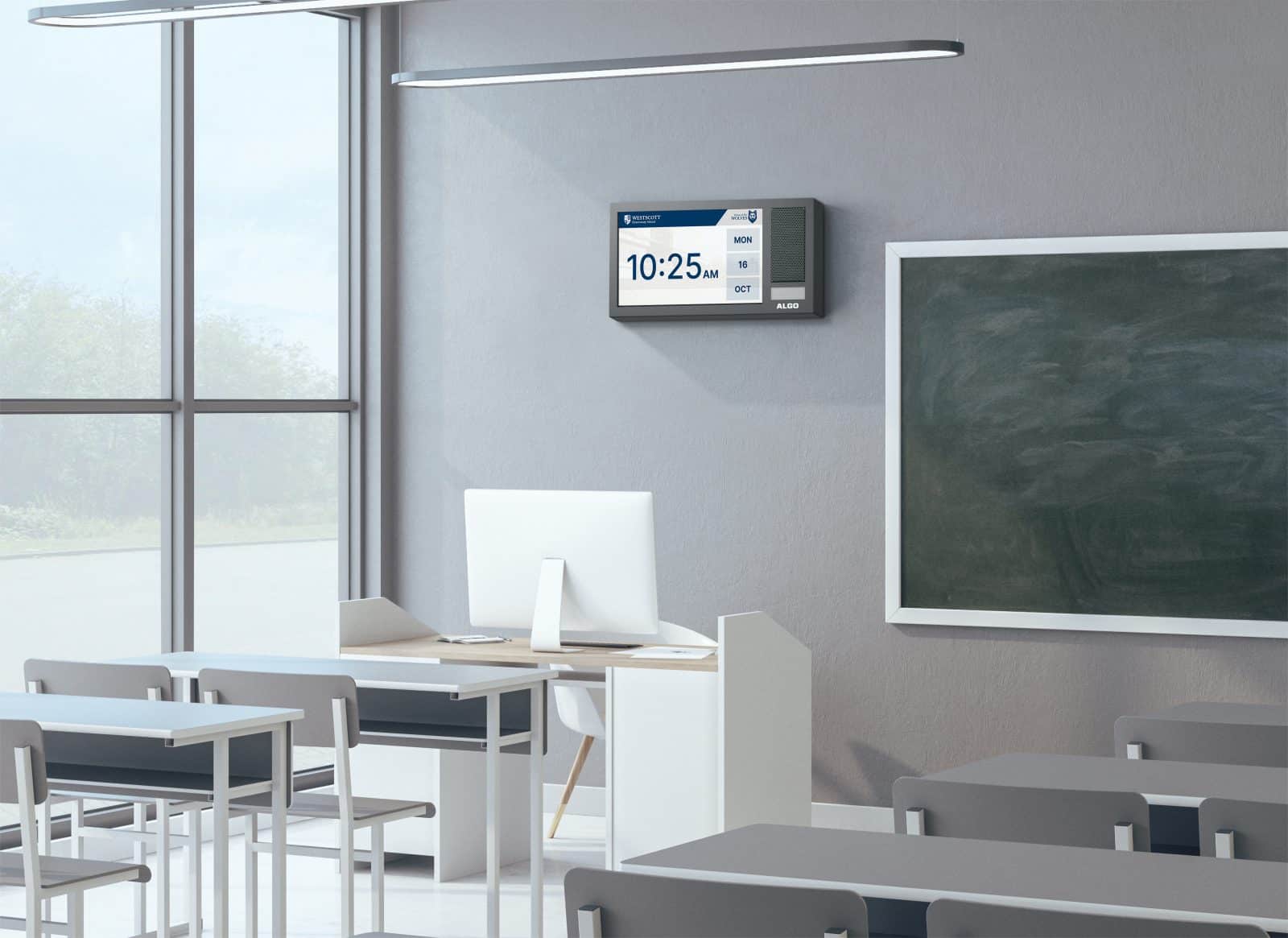 Algo IP 8410 Display Speaker mounted on a wall in a school classroom displaying the time.