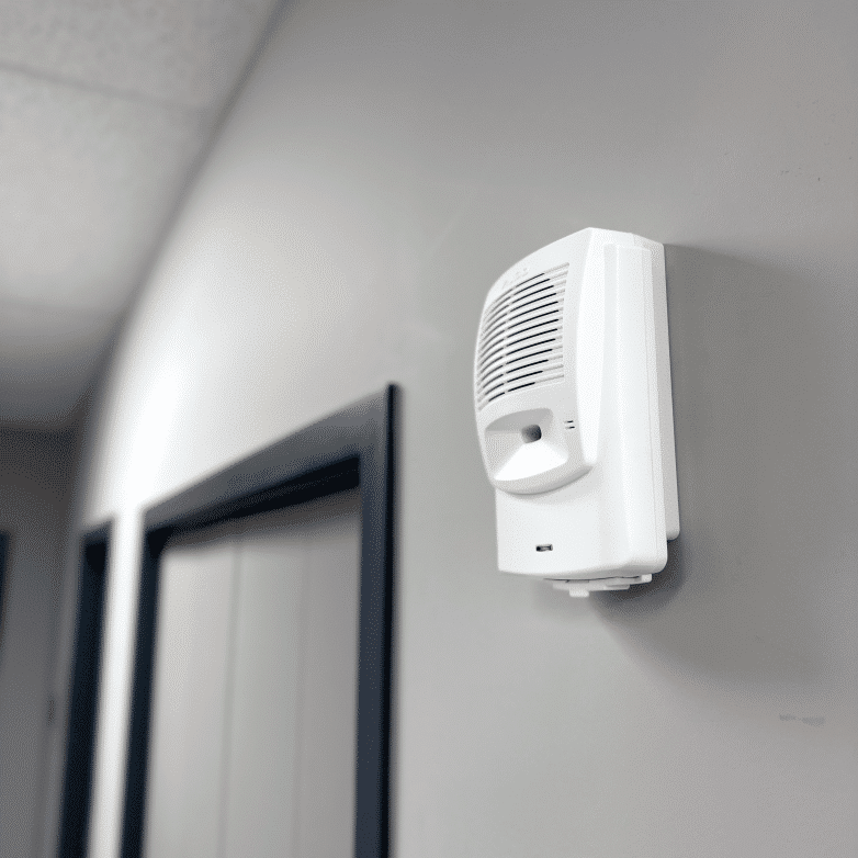 Image of Algo 8180 Audio Alerter mounted on a wall in a hallway for loud alerting.